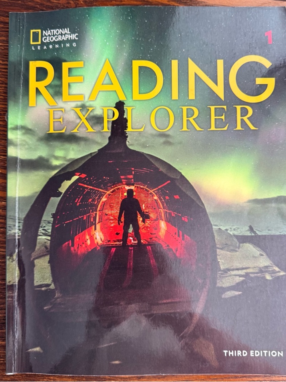 National Geographic Reading Explorer — Black and Green Cover with Yellow Title